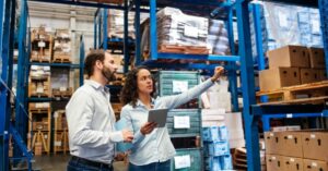 supply chain managers talking in a warehouse