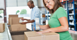 people packing boxes in a warehouse