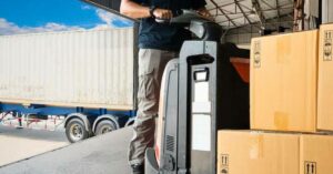 Man using an electric pallet jack